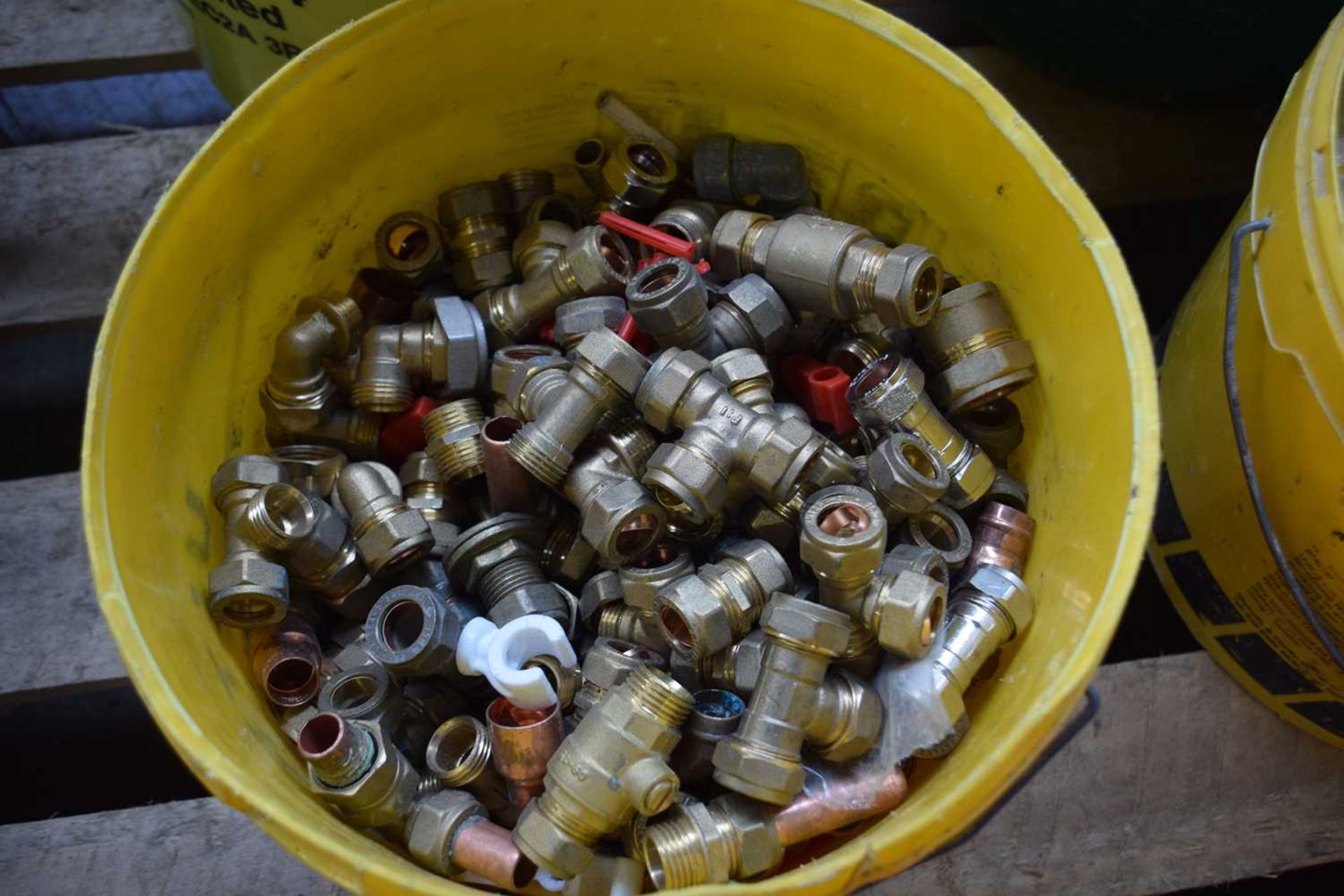 Bucket containing a large quantity of 15mm pipe fittings to include T joints, straight joints and 90