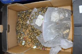 Box containing a large quantity of brass single ring fixings