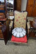 EARLY REGENCY RECLINING CHAIR WITH RETAILERS NAME FOR A HARDY, CROMER, WITH FABRIC COVERING