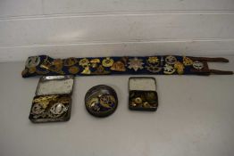 BAG CONTAINING QUANTITY OF OLD TINS AND MILITARY BADGES AND BELT CONTAINING A QUANTITY OF BRITISH