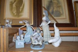 THREE LLADRO FIGURINES, NAO MODEL CAT AND A ROYAL DOULTON 'IMAGES OF NATURE' OTTER FIGURE (5)