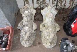 PAIR OF CONCRETE GARDEN ORNAMENTS - SEATED FIGURES