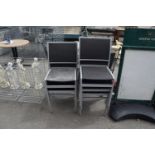 Seven metal rattan garden chairs