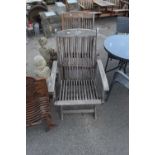 Two folding wooden garden chairs