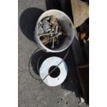 Bucket of mixed and varying sized nuts and bolts