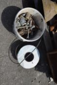Bucket of mixed and varying sized nuts and bolts