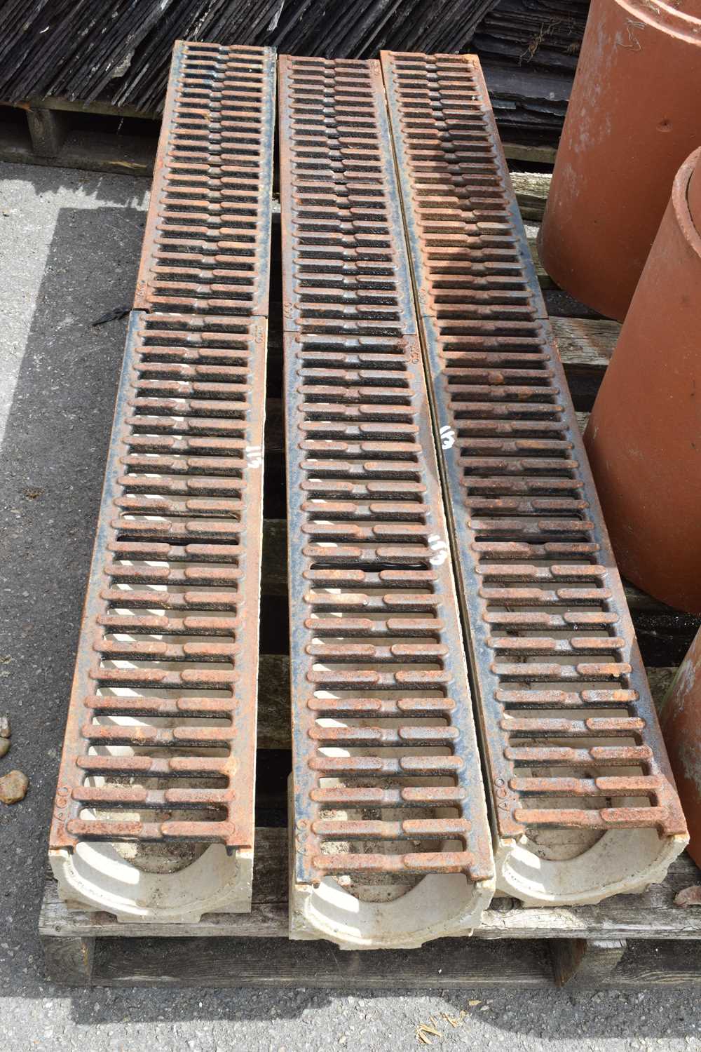 Three composite drainage gulleys with cast metal tops, approx 100cm x 12cm, depth 10cm