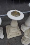 Brass sun dial on a composite plinth, height approx 55cm