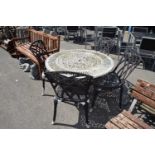 Cast decorative garden table with four chairs, table height 70cm