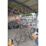 Large iron Ferris wheel with eight hanging glass lanterns