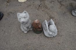 Three composite garden statues, dog, owl and cat in a bag, tallest 32cm