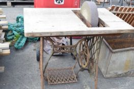 Vintage Singer sewing machine base with grinding stone