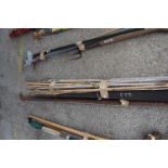 Bundled quantity of bamboo canes, longest 180cm, together with a small roll of roofing felt and a