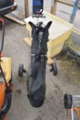 Bagged set of golf clubs with a carry trolley