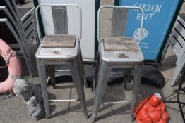 Two vintage metal bar stools, total height approx 100cm