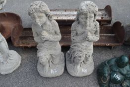 Pair of composite garden statues modelled as Praying girls, height 70cm