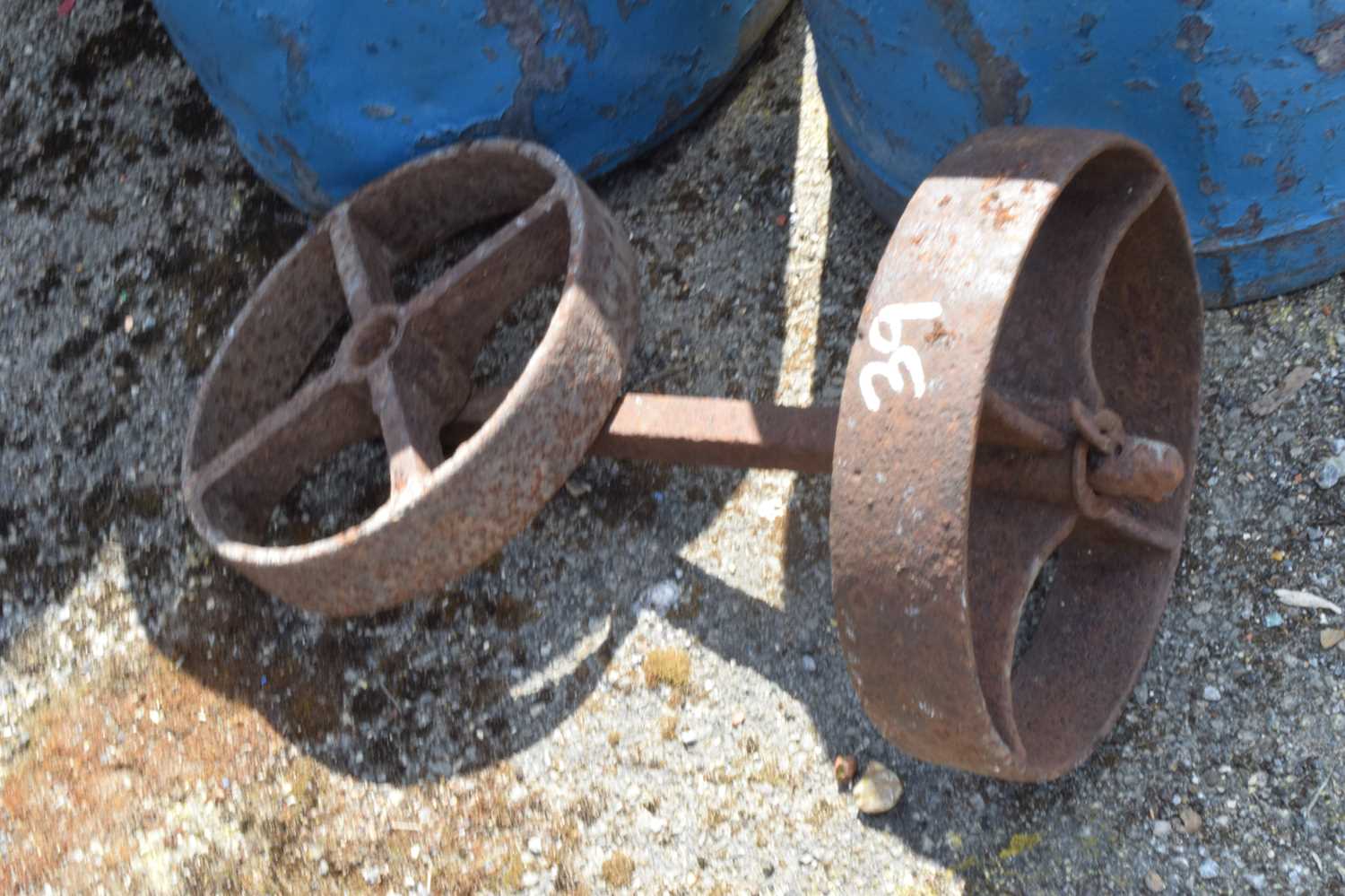 Small cast iron axle with wheels