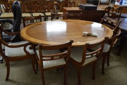 REPRODUCTION MAHOGANY AND CROSS BANDED OVAL DINING TABLE TOGETHER WITH A SET OF EIGHT REPRODUCTION
