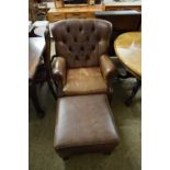 MODERN BROWN BUTTONED LEATHER ARMCHAIR AND ACCOMPANYING FOOT STOOL