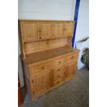 MODERN PINE KITCHEN DRESSER WITH FOUR SMALL DOORS TO BACK AND A BASE WITH SIX DRAWERS AND TWO DOORS,