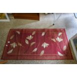 SMALL FLORAL DECORATED RED RUG, 150CM LONG