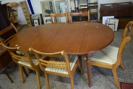 REPRODUCTION OVAL EXTENDING DINING TABLE ON FLUTED LEGS TOGETHER WITH A SET OF SIX SABRE LEG