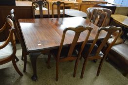 EARLY 20TH CENTURY MAHOGANY EXTENDING DINING TABLE ON CABRIOLE LEGS TOGETHER WITH A SET OF SIX