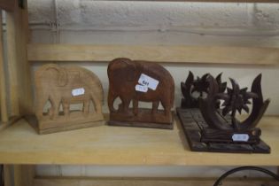FAR EASTERN SLIDING BOOK RACK TOGETHER WITH A PAIR OF ELEPHANT FORMED BOOKENDS (3)