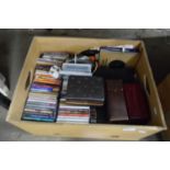 BOX OF CDS, CASSETTES, MODEL CASED GAMING SET ETC