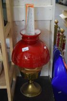 OIL LAMP WITH RED GLASS SHADE