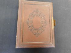 Victorian carte de visite album containing a few cards only, 4to, panelled calf, brass clasp and