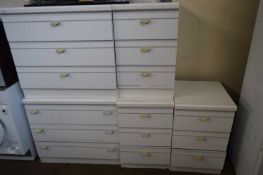 TWO WHITE MELAMINE BEDROOM CHESTS AND THREE MATCHING BEDSIDE CABINETS