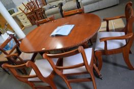 MAHOGANY OVAL EXTENDING DINING TABLE AND SIX CHAIRS