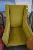 ANTIQUE DEEP SEATED ARMCHAIR WITH GREEN UPHOLSTERY AND SPRUNG SEAT