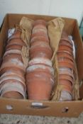 BOX CONTAINING SMALL TERRACOTTA PLANT HOLDERS
