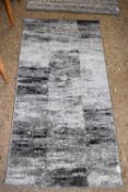 RECTANGULAR GREY PRINTED RUG (Pleae note VAT is to be added on hammer price for this lot)