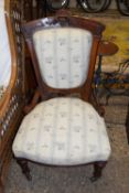 LATE VICTORIAN AMERICAN WALNUT FRAMED NURSING CHAIR WITH FLORAL UPHOLSTERY