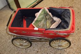 CHILD'S PRAM WITH RED FABRIC HOOD AND COVER
