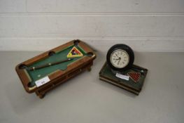 CLOCK MOUNTED ON A MINIATURE SNOOKER TABLE, AND FURTHER MINIATURE SNOOKER TABLE WITH CUE