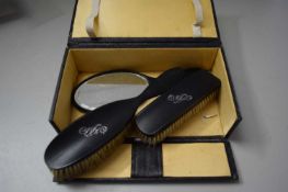 CASED DRESSING TABLE SET WITH EBONISED BACK AND SILVER MONOGRAM