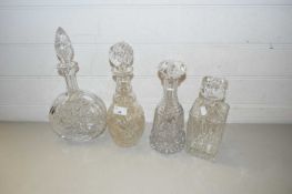 GROUP OF FOUR CUT GLASS DECANTERS