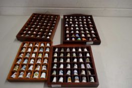 QUANTITY OF CERAMIC THIMBLES IN CUSTOM MADE WOODEN DISPLAY CABINETS