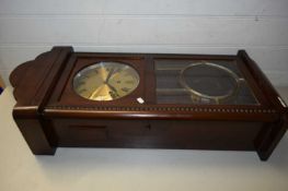LARGE WALL CLOCK IN MAHOGANY CASE, WITH PENDULUM AND KEY