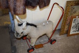 CHILD'S TOY OF A DONKEY MOUNTED ON WHEELS