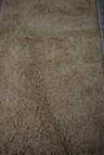 BROWN TUFTED FLOOR RUG (Pleae note VAT is to be added on hammer price for this lot)