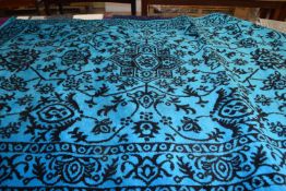 LARGE RUG WITH GEOMETRIC DESIGN ON BLUE/GREEN GROUND (Pleae note VAT is to be added on hammer