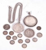 Small collection of English and Foreign coinage including 1921 USA silver dollar solder mounted on a