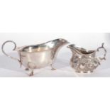 Mixed Lot: George V sauce boat of typical form with card cut rim and scrolled handles, supported