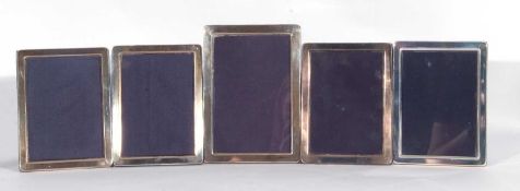 Mixed Lot: set of four modern plain rectangular silver mounted photograph frames with blue velvet