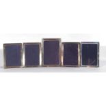 Mixed Lot: set of four modern plain rectangular silver mounted photograph frames with blue velvet